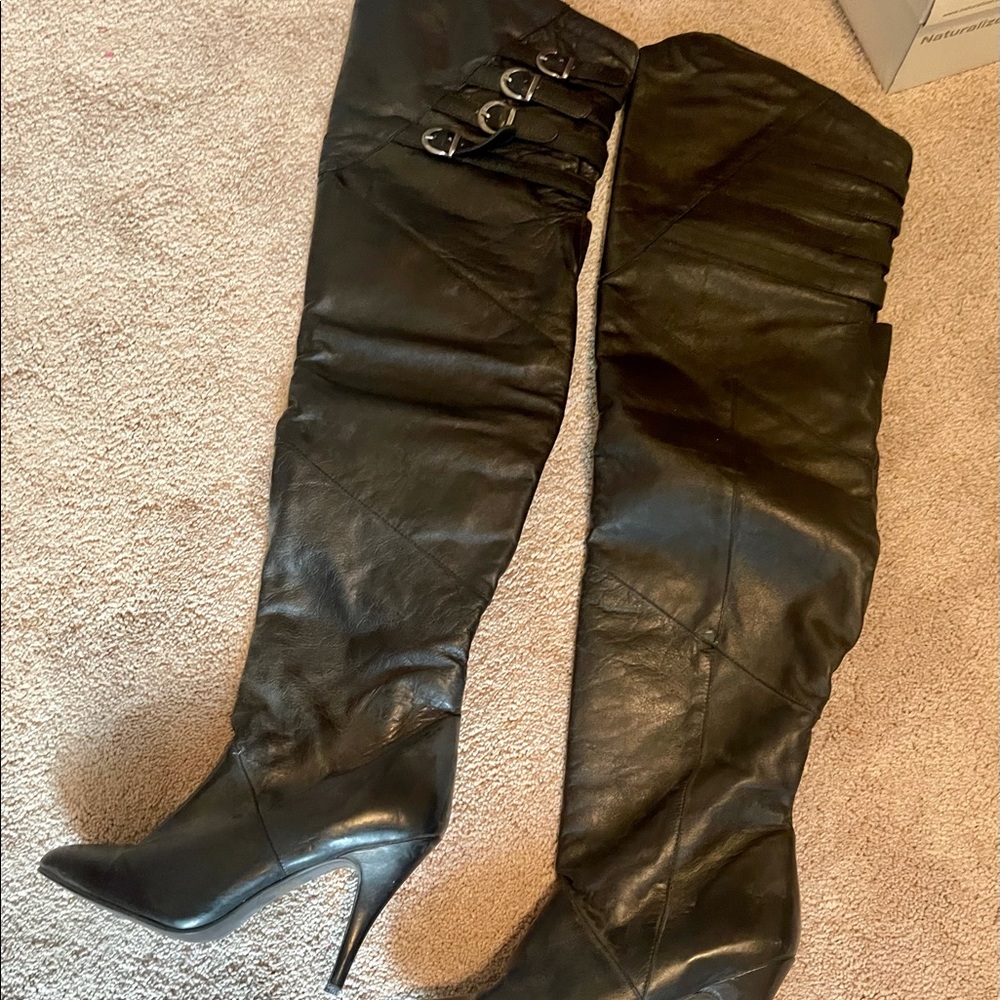 Thigh high black leather boots